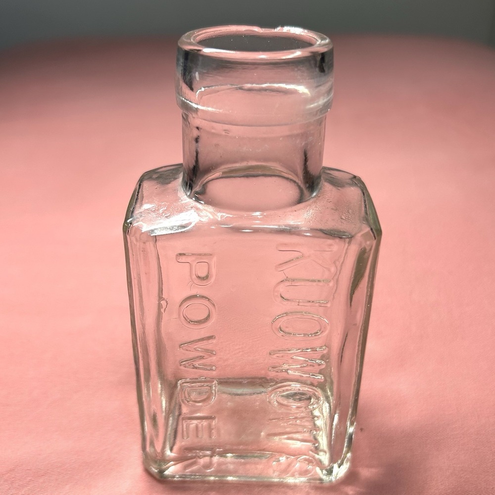 Vintage Kuowow's Powder Clear Thick Glass Bottle 5" Embossed Medicine Bud Vase